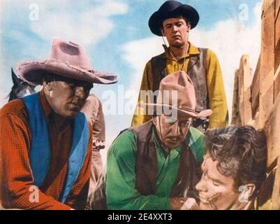 STREETS OF LAREDO 1949 Paramount Pictures film with from left: William Bendix, William Holden (standing) , Joe Dominguez, James Bell Stock Photo