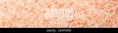 Pink Himalayan salt on a white background in top view, natural coarse crystals for seasoning designs Stock Photo