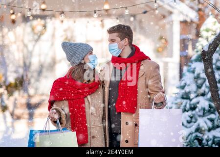 Family with purchases posing on street, enjoying winter sales Stock Photo