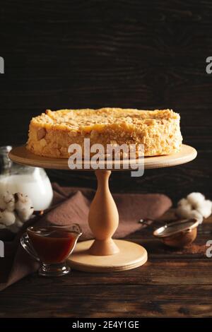 Concept of cooking with tasty Napoleon cake on wooden background Stock Photo