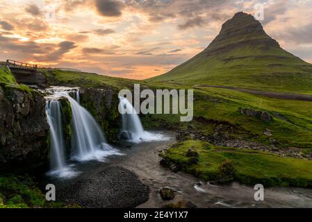 Dramatic sky over the iconic Kirkjufell mountain in summer Stock Photo