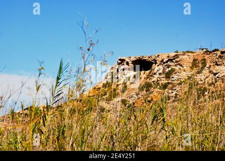 Fougasse cave view from Ramla Bay in Gozo Island Malta Stock Photo