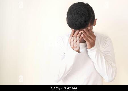 Young man suffering headache, close up  Stock Photo