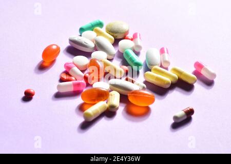 group of various pills on pink background Stock Photo