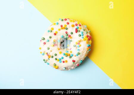 One tasty donut on two tone background Stock Photo