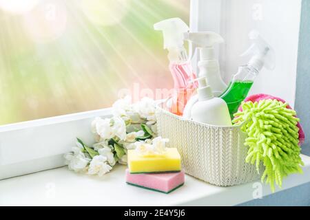 Spring cleaning office or house concept. Different cleaning supplies over  blurred spring background among floating soap bubbles. Copy space Stock  Photo - Alamy