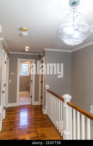 Empty second floor landing to stairs and guest bedrooms Stock Photo