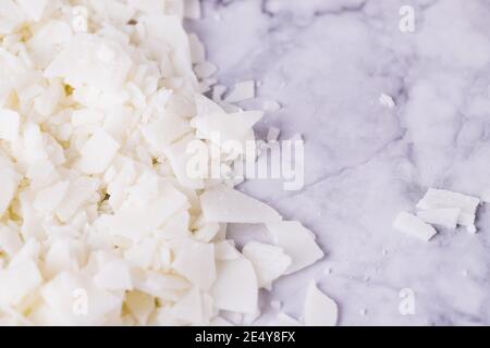 White soy wax flakes for candle making on a light gray marble background  Stock Photo - Alamy