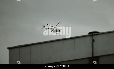 Madrid, Spain; April 23 2020: Spanish National Police (Policía Nacional) helicopter patrolling Madrid streets during COVID 19 lockdown Stock Photo