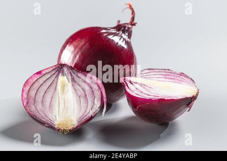 Red onions isolated on gray background. Stock Photo