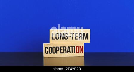 Long-term cooperation conceptual image for businessman and freelancer maded with wooden pegs, photo Stock Photo