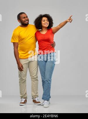 african american couple pointing to something Stock Photo