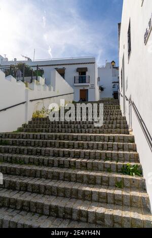 'Vejer de la Frontera, Spain - 17 January, 2021: stairs leading up through a narrow alley in the historic city center of Vejer de la FronteraVejer de Stock Photo