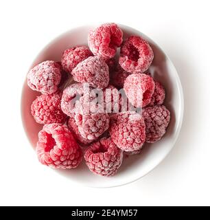 White bowl of frozen raspberry isolated on white background, top view Stock Photo
