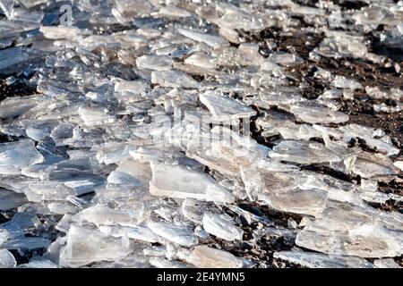 WINTER CHUNKS OR SLABS OF ICE ON A ROAD Stock Photo