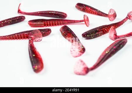 Jig silicone fishing lures isolated on a white background. Silicone fishing  baits isolated. Colorful baits. Fishing spinning bait. Silicone soft plast  Stock Photo - Alamy