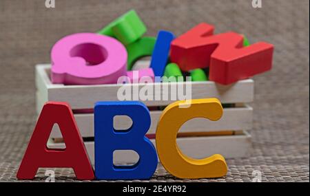 Colorful wooden letters in a wooden box, ABC Stock Photo - Alamy