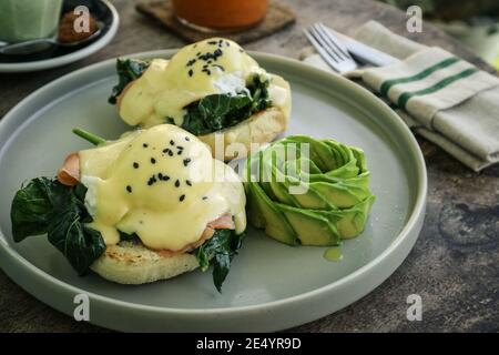 Avocado toast with poached egg, salad leves and cherry tomato for breackfast closeup Stock Photo