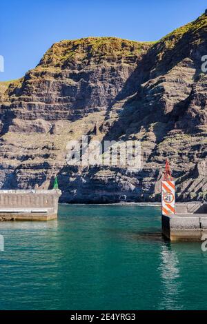 Cliffs of Los Gigantes and marina entrance at Los Gigantes resort town, Tenerife island, port in the Atlantic Ocean, Canary Islands, Spain Stock Photo