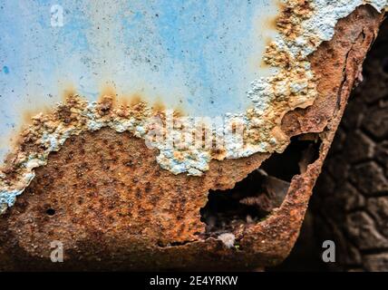 Rust on a blue car over the wheel Stock Photo