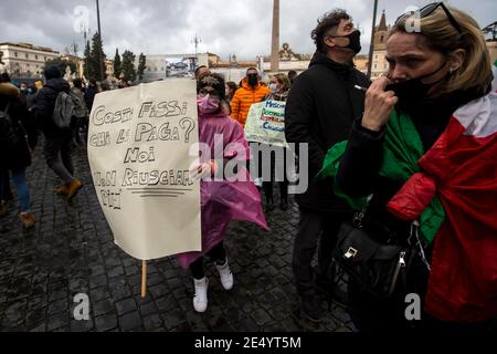 Rome, Italy. 25th Jan 2021. Rome, 25/01/2021. Today, a national demonstration in Piazza del Popolo to highlight the dramatic situation of the Hospitality Industry in Italy during the so called 'second wave' of the pandemic Covid-19/Coronavirus, to call the Government to act for immediate investments, aids (Ristori), and policies to save their industry. Credit: LSF Photo/Alamy Live News Stock Photo