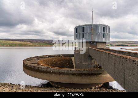 The outlet tower and spillway of the Grimwith Reservoir near Howgill, North Yorkshire, England, UK Stock Photo