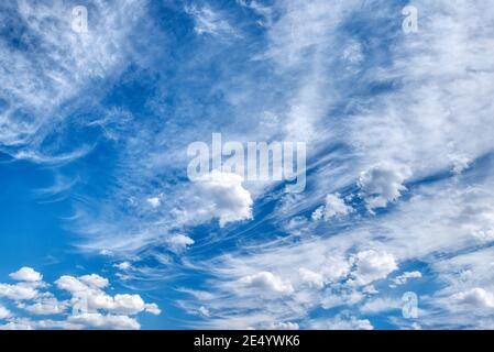 White fluffy clouds in the blue sky Stock Photo