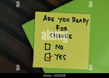 Are You Ready For Change write on sticky notes and supported by additional services write on a sticky notes isolated on Wooden Table. Stock Photo