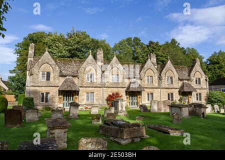 Cottages within the grounds of St Mary's Church, Church Green, Witney, a historic market town on the River Windrush, Oxfordshire, UK. Stock Photo