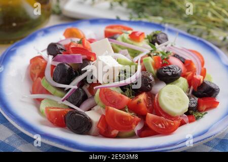 Greek salad on a rustic table Stock Photo