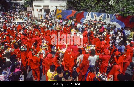 SAN FRANCISCO DE YARE, MIRANDA STATE, VENEZUELA, 1988 - Devil dancers in costumes with masks during Corpus Christi Day, a religious festival celebration in the streets. Stock Photo