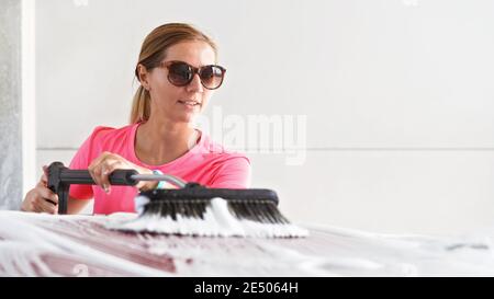 Woman in Pink Dress Washing Her Tiny Car with Nano Foam at Car Wash Stock  Image - Image of foam, auto: 250389741