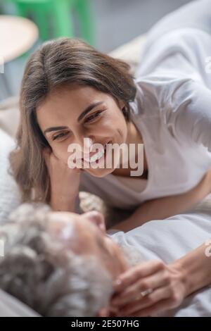 Young woman gently looking at her husband Stock Photo