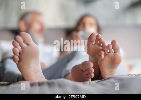 Man and woman staying in bed together in the morning Stock Photo