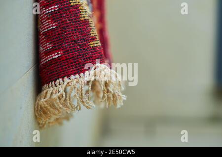 Small carved rug on white background Stock Photo