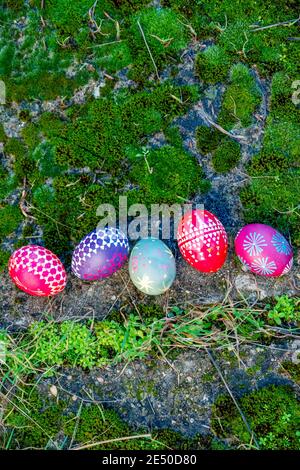 Five Easter eggs in moss, handmade with wax technique, old Eastern Germany tradition, craftsmanship, custom made easter eggs, Sorbian, Upper and Lower Stock Photo