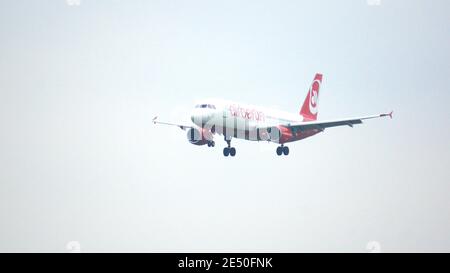 MUNICH, GERMANY - 11 OCTOBER 2015: Air Berlin Airbus A320 passenger plane arrival and landing at Munich Airport Stock Photo