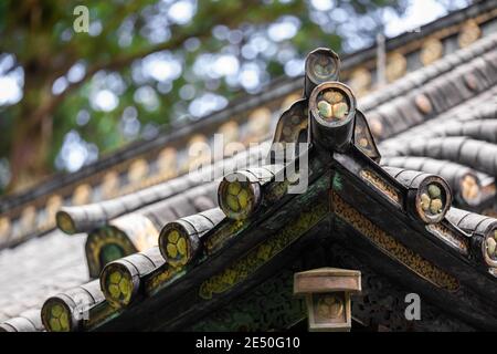 Close up of the roof of a Japanese temple, against a bokeh background Stock Photo