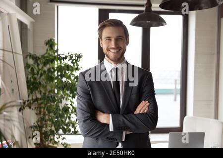Head shot portrait successful businessman with arms crossed in office Stock Photo