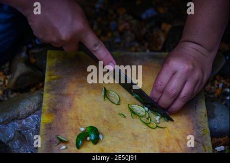 man slicing limes Stock Photo