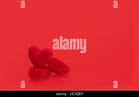 Close up red hearts are placed on red background. Valentine's Day concept. Stock Photo