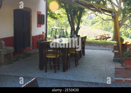Cute summer landscape in Tuscany. The table is outside. House territory. Hotel Borgovera in Castiglion Fiorentino, Italy, Tuscany, Grosseto, Manciano Stock Photo