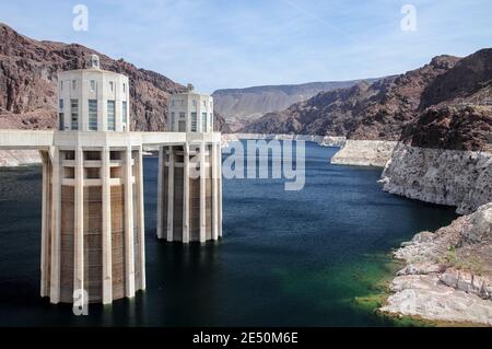 View of the pen stock towers over Lake Mead at Hoover Dam, between Arizona and Nevada states, USA. Stock Photo