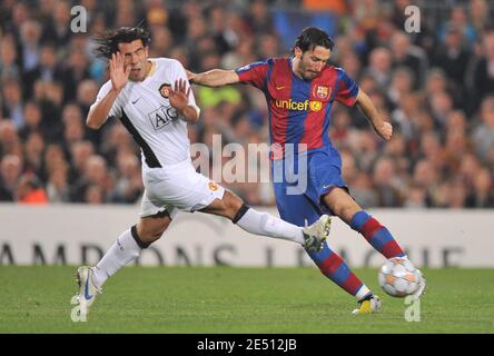 Manchester United's Carlos Tevez and Barcelona's Gianluca Zambrotta battle for the ball during the UEFA Champions League semi-finals, first leg, Soccer match, FC Barcelona vs Manchester United at the Nou Camp stadium in Barcelona, Spain on April 23, 2008. The match ended in a 0-0 draw. Photo by Steeve McMay/Cameleon/ABACAPRESS.COM Stock Photo