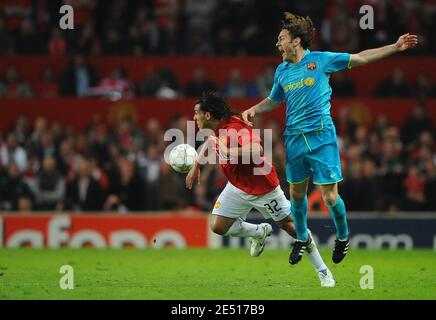 FC Barcelona's Carles Puyol challenges Manchester United's Carlos Tevez during the UEFA Champions League Semi-Final second leg soccer match between Manchester United and Barcelona at Old Trafford in Manchester, England on April 29 2008. Manchester won 1-0. Photo by Steeve McMay/Cameleon/ABACAPRESS.COM Stock Photo