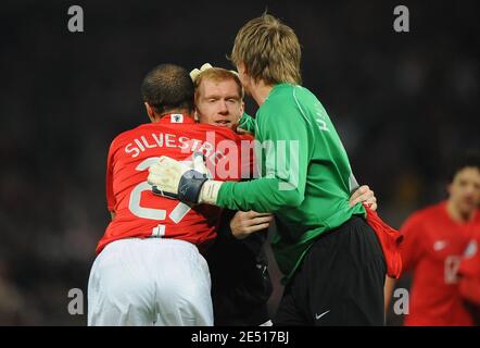 Manchester United's Mikael Silvestre celebrates with Paul Scholes and Tomasz Kuszcak at the end of the UEFA Champions League Semi-Final second leg soccer match between Manchester United and FC Barcelona at Old Trafford in Manchester, England on April 29 2008. Manchester won 1-0. Photo by Steeve McMay/Cameleon/ABACAPRESS.COM Stock Photo