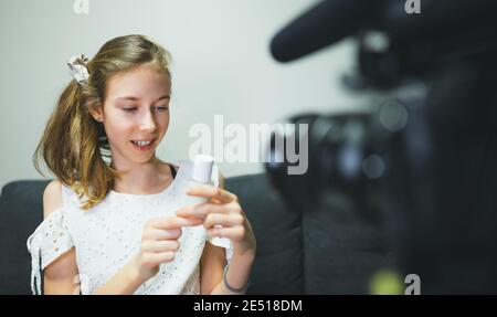Teenage girl making video blog about skincare. Vlog concept. Stock Photo