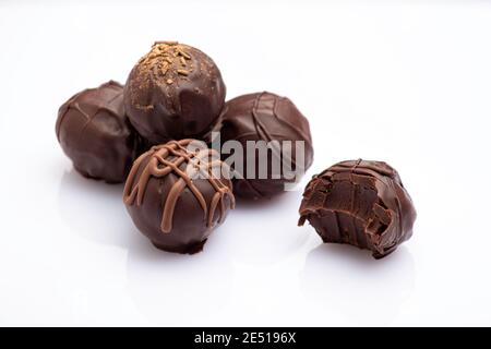 variety of handmade gourmet chocolate truffle candy isolated on white background Stock Photo