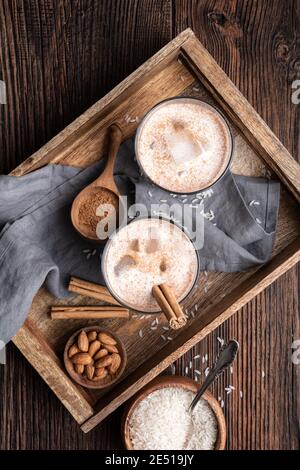 Horchata, ice cold sweet Mexican rice milk drink with almonds, vanilla and cinnamon in glass jars Stock Photo