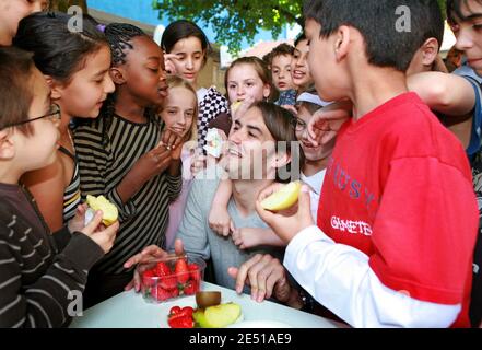 French TV chef Cyril Lignac is surrounded by school children as he helps launching the campaign 'A Fruit at the Recess' to spur on children to eat more fruits, in a school in Bordeaux, southwestern France on May 6, 2008. Photo by Patrick Bernard/ABACAPRESS.COM Stock Photo